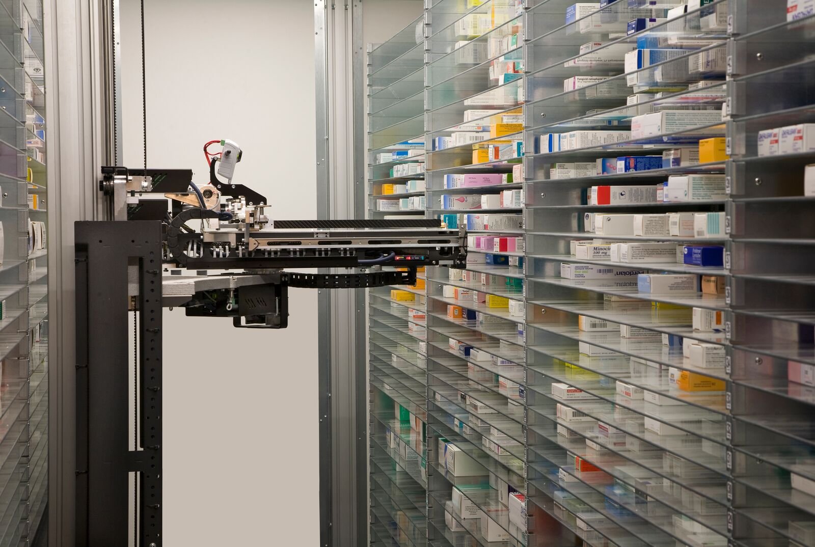 a machine in a room with shelves of medicine