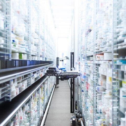 a room with shelves and a cart
