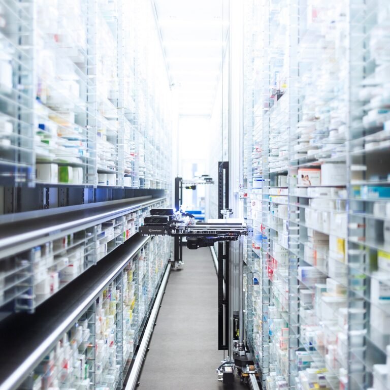 a room with shelves and a cart